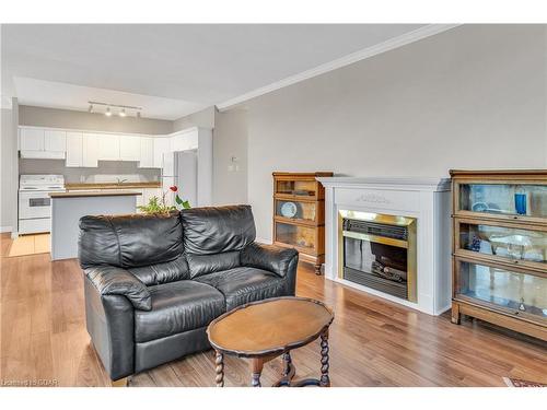 311-60 Wyndham Street S, Guelph, ON - Indoor Photo Showing Living Room With Fireplace