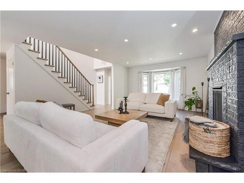 24 Bridlewood Drive, Guelph, ON - Indoor Photo Showing Living Room With Fireplace