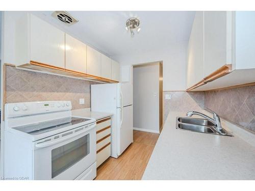 302-57 Conroy Crescent, Guelph, ON - Indoor Photo Showing Kitchen With Double Sink