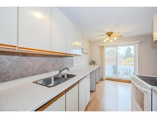 302-57 Conroy Crescent, Guelph, ON - Indoor Photo Showing Kitchen With Double Sink