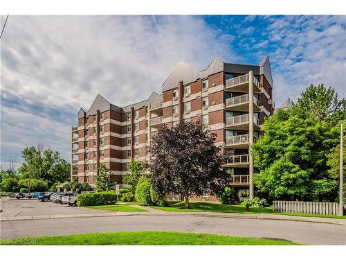 401-8 Christopher Court, Guelph, ON - Outdoor With Balcony With Facade