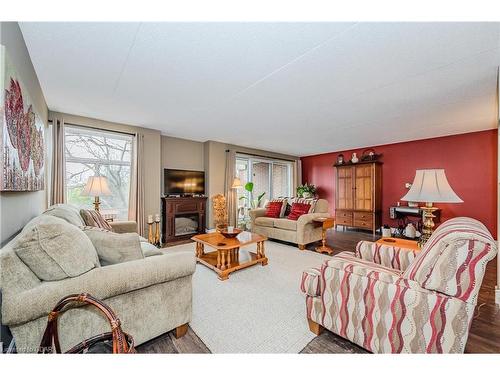 401-8 Christopher Court, Guelph, ON - Indoor Photo Showing Living Room With Fireplace