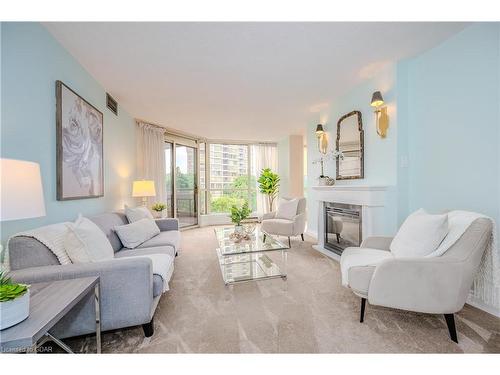 406-55 Kingsbridge Garden Circle, Mississauga, ON - Indoor Photo Showing Living Room With Fireplace