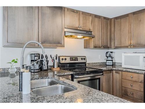 412-45 Kingsbury Square, Guelph, ON - Indoor Photo Showing Kitchen With Double Sink