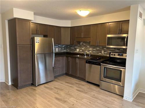 81W-81 Westminster Crescent, Fergus, ON - Indoor Photo Showing Kitchen With Double Sink