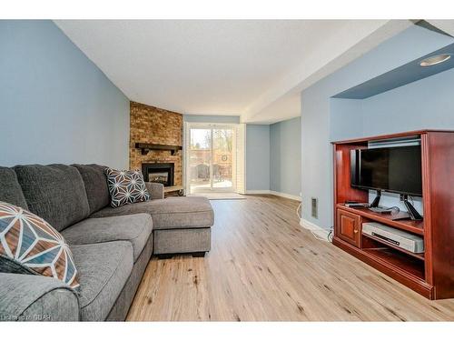 54-3339 Council Ring Road, Mississauga, ON - Indoor Photo Showing Living Room With Fireplace