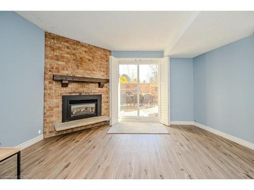 54-3339 Council Ring Road, Mississauga, ON - Indoor Photo Showing Living Room With Fireplace