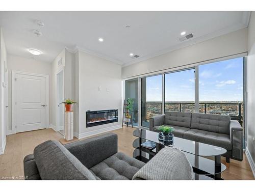 905-1878 Gordon Street, Guelph, ON - Indoor Photo Showing Living Room With Fireplace