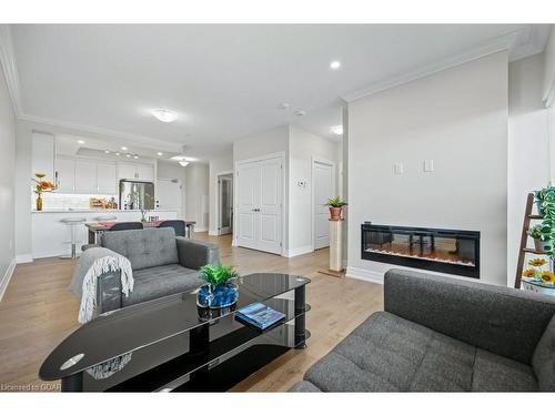 905-1878 Gordon Street, Guelph, ON - Indoor Photo Showing Living Room With Fireplace