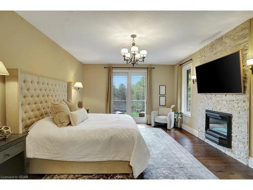 209 Hume Road, Puslinch, ON - Indoor Photo Showing Bedroom With Fireplace