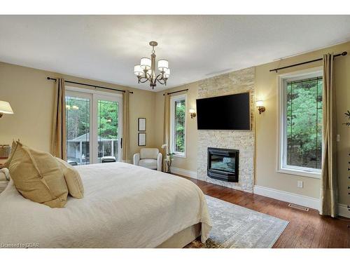 209 Hume Road, Puslinch, ON - Indoor Photo Showing Bedroom With Fireplace