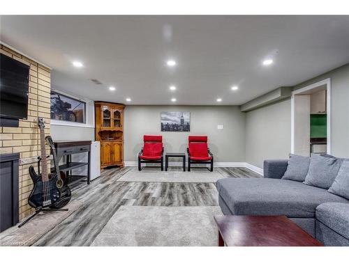 692 Speedvale Avenue E, Guelph/Eramosa, ON - Indoor Photo Showing Basement With Fireplace