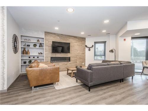 203-332 Gosling Gardens, Guelph, ON - Indoor Photo Showing Living Room With Fireplace