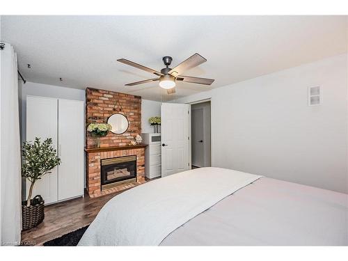 184 Dufferin St Street, Guelph, ON - Indoor Photo Showing Bedroom With Fireplace