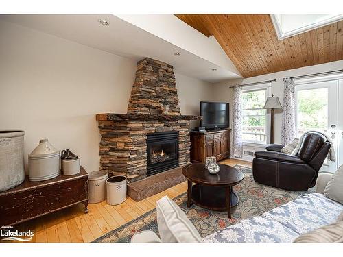 2059 Upper Big Chute Road, Coldwater, ON - Indoor Photo Showing Living Room With Fireplace