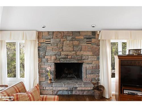 1250 Waldmere Road, Bracebridge, ON - Indoor Photo Showing Living Room With Fireplace