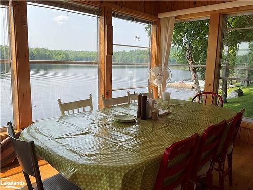 185 Wilson Lake, Port Loring, ON - Indoor Photo Showing Dining Room With Body Of Water
