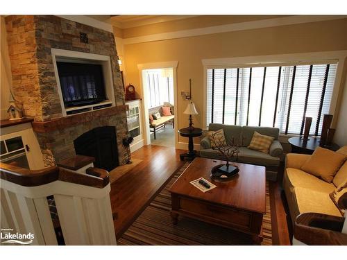 Villa 13, Week 8-1020 Birch Glen Road, Baysville, ON - Indoor Photo Showing Living Room With Fireplace