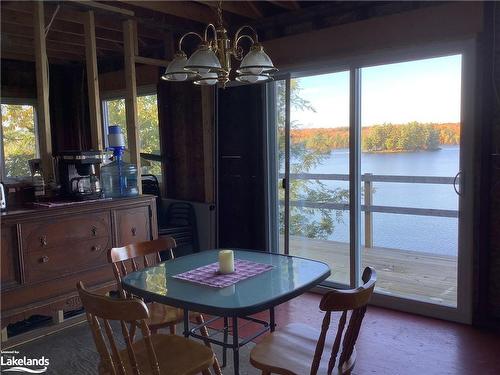 245 Wilson Lake, Port Loring, ON - Indoor Photo Showing Dining Room With Body Of Water