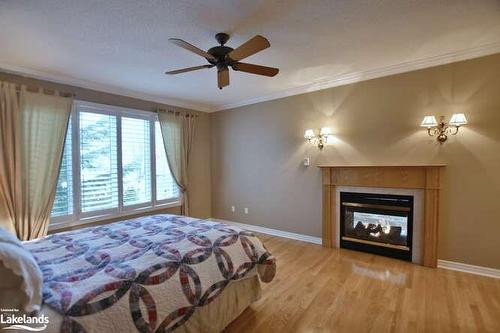 46 Waterfront Circle, Collingwood, ON - Indoor Photo Showing Bedroom With Fireplace