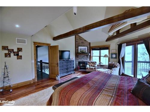 128 Snowbridge Way, The Blue Mountains, ON - Indoor Photo Showing Bedroom With Fireplace