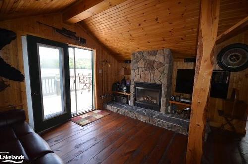 10365 Rabbit Lake, Temagami, ON - Indoor Photo Showing Living Room With Fireplace