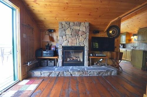 10365 Rabbit Lake, Temagami, ON - Indoor Photo Showing Living Room With Fireplace