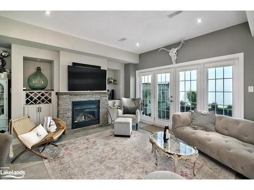 5-209707 26 Highway, The Blue Mountains, ON - Indoor Photo Showing Living Room With Fireplace