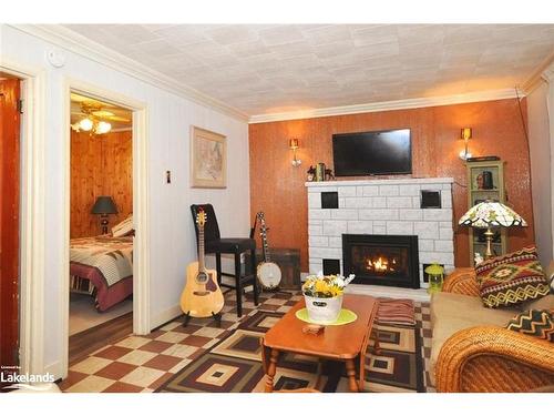 1465 Riverside Drive, Britt, ON - Indoor Photo Showing Living Room With Fireplace