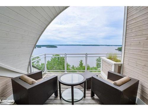 T202 (B2/C1)-1869 Muskoka Road 118 W, Muskoka Lakes, ON - Outdoor With Body Of Water With Exterior