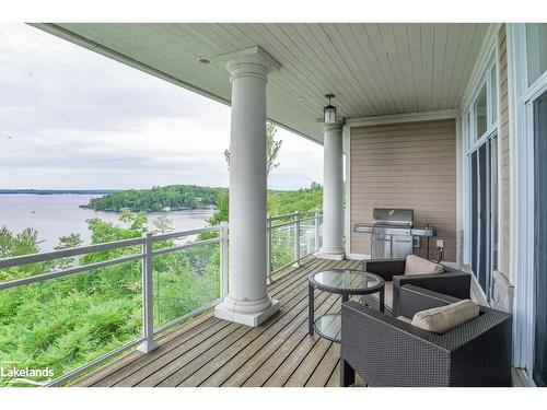 T202 (B2/C1)-1869 Muskoka Road 118 W, Muskoka Lakes, ON - Outdoor With Body Of Water With Deck Patio Veranda With Exterior
