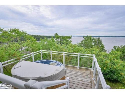 T202 (B2/C1)-1869 Muskoka Road 118 W, Muskoka Lakes, ON - Outdoor With Body Of Water With Deck Patio Veranda With View