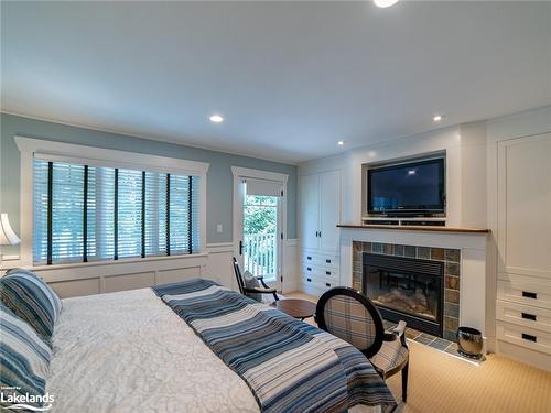 1020 Birch Glen Villa 12 Week 4 Road, Baysville, ON - Indoor Photo Showing Bedroom With Fireplace