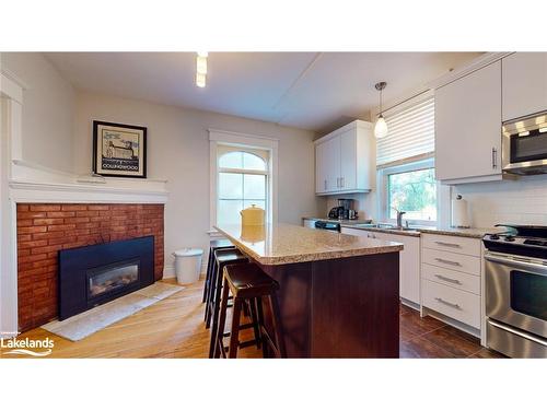 143 Fourth Street W, Collingwood, ON - Indoor Photo Showing Kitchen With Fireplace With Double Sink