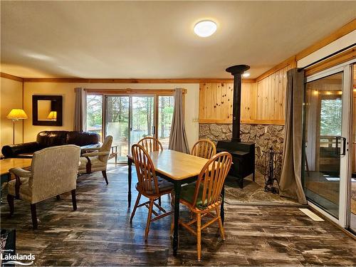 1038 Clarence Private, Bracebridge, ON - Indoor Photo Showing Dining Room With Fireplace