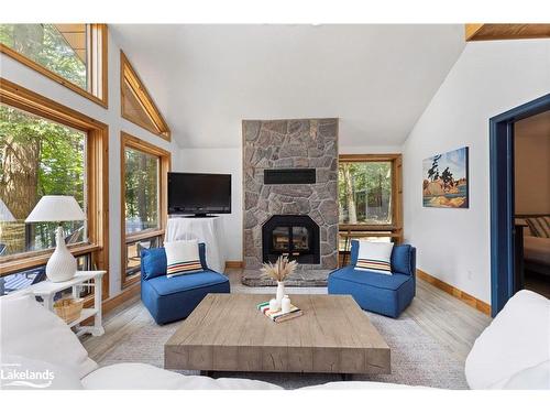 180 Bigwin Island, Baysville, ON - Indoor Photo Showing Living Room With Fireplace