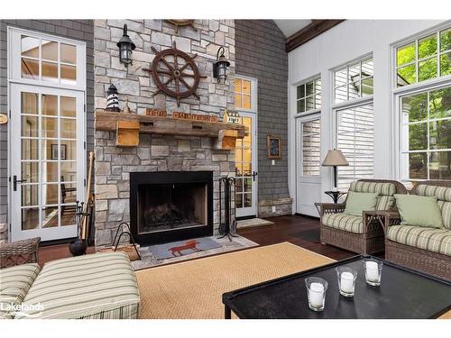 166 Bigwin Island, Baysville, ON - Indoor Photo Showing Living Room With Fireplace