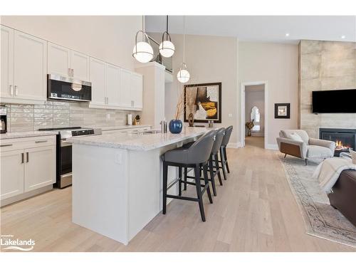 113 Tekiah Road, The Blue Mountains, ON - Indoor Photo Showing Kitchen With Fireplace With Upgraded Kitchen