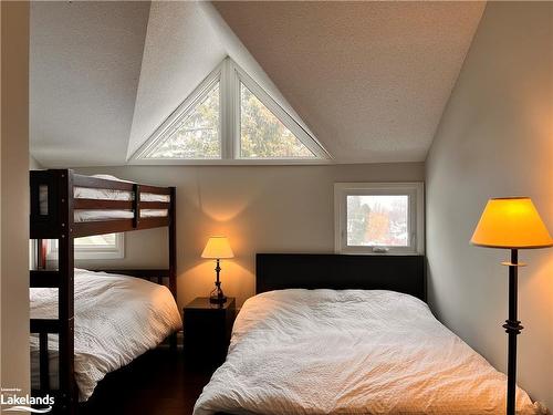 208-796404 19 Grey Road, The Blue Mountains, ON - Indoor Photo Showing Bedroom