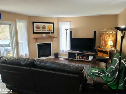 20-1591 Hidden Valley Road, Huntsville, ON - Indoor Photo Showing Living Room With Fireplace