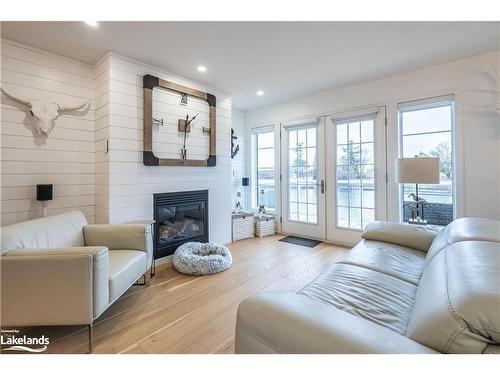 6-64 River Road E, Wasaga Beach, ON - Indoor Photo Showing Living Room With Fireplace