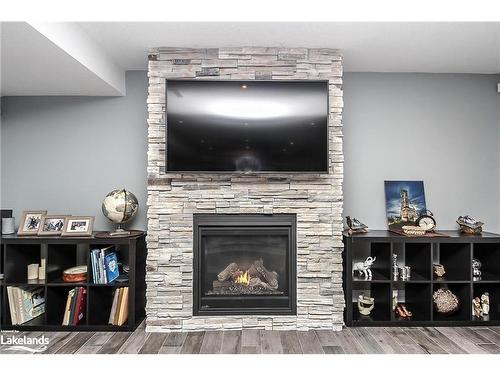 16 Sunset Court, Wasaga Beach, ON - Indoor Photo Showing Living Room With Fireplace
