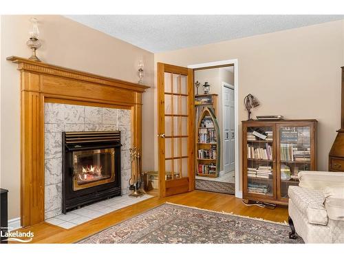99 Bridgedale Crescent, Port Sydney, ON - Indoor Photo Showing Living Room With Fireplace