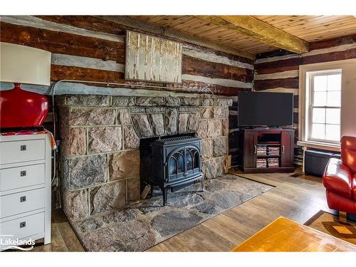 83 Beach Road, Tiny, ON - Indoor Photo Showing Living Room With Fireplace