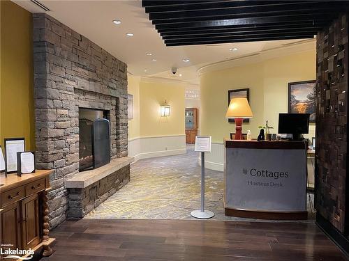 S449-1050 Paignton House Road, Minett, ON - Indoor With Fireplace