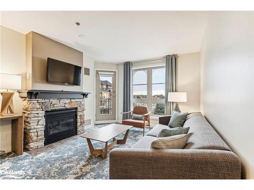 317-170 Jozo Weider Boulevard, The Blue Mountains, ON - Indoor Photo Showing Living Room With Fireplace