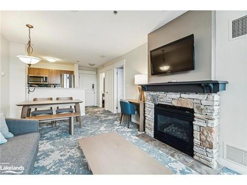 317-170 Jozo Weider Boulevard, The Blue Mountains, ON - Indoor Photo Showing Living Room With Fireplace