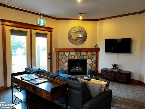 110-184 Snowbridge Way, The Blue Mountains, ON - Indoor Photo Showing Living Room With Fireplace