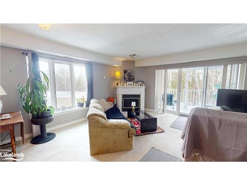 3-10 Mulligan Lane, Wasaga Beach, ON - Indoor Photo Showing Living Room With Fireplace