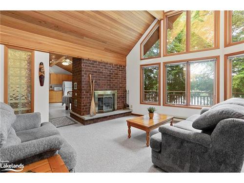 26 Wa Zone L, Loon Bay, Carling, ON - Indoor Photo Showing Living Room With Fireplace